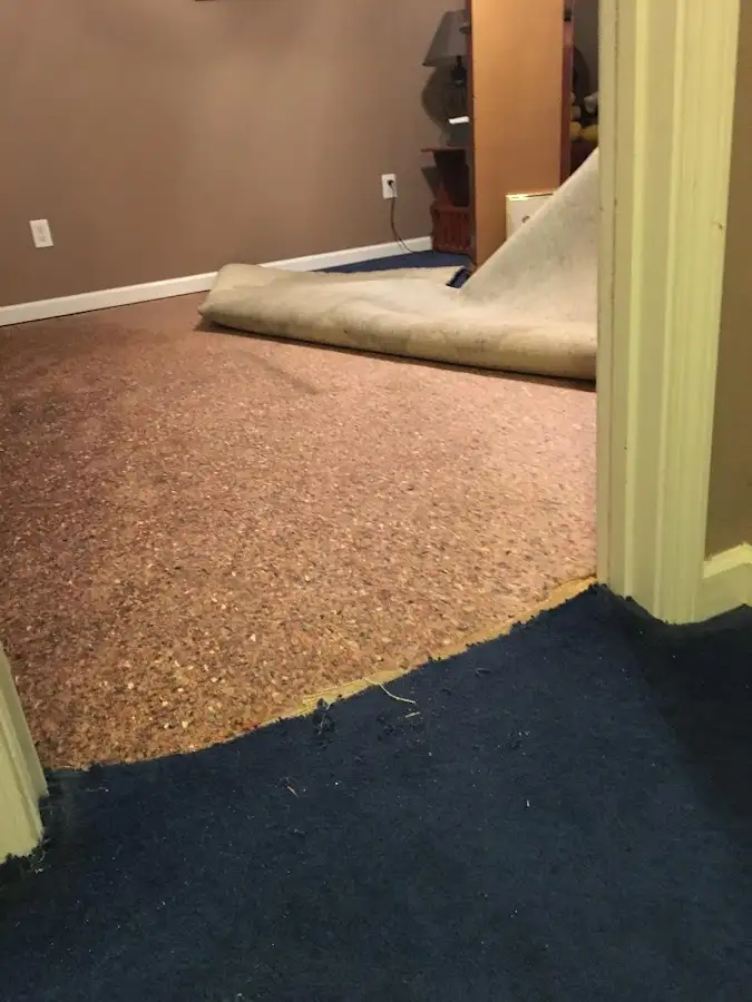 Carpet pad removal revealing water damage during Drying & Dehumidification in Wappingers Falls
