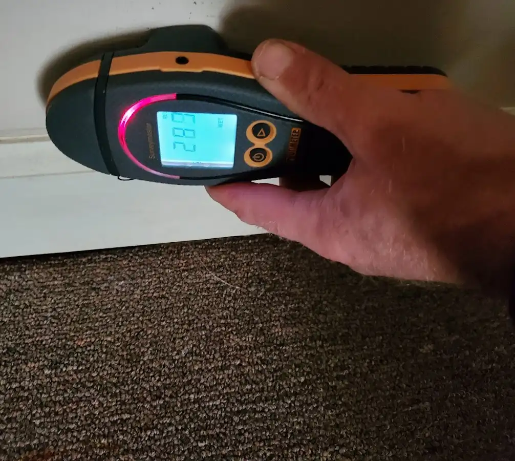 Moisture detection at baseboard during Storm Damage Restoration in Wappingers Falls